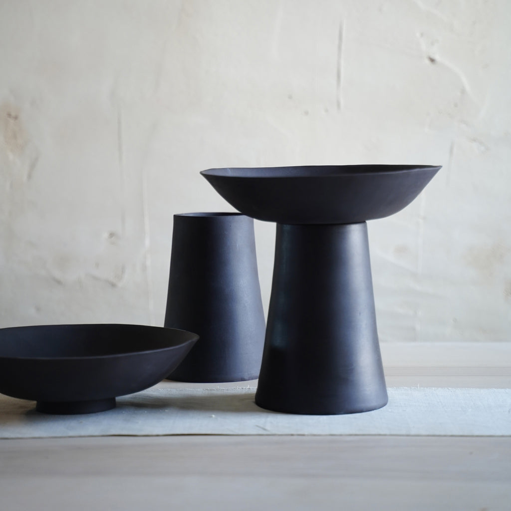 Minimalist black ceramic bowl with footed base, handmade stoneware decor object