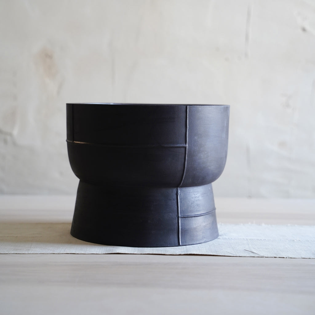 Modern black ceramic decor bowl with elevated foot, handmade stoneware