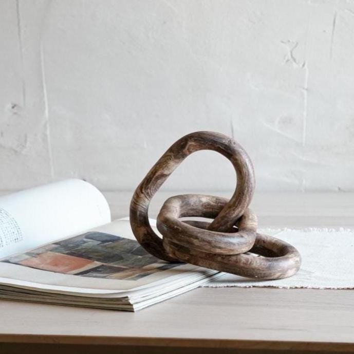 3-link marbled chain sculpture on white background