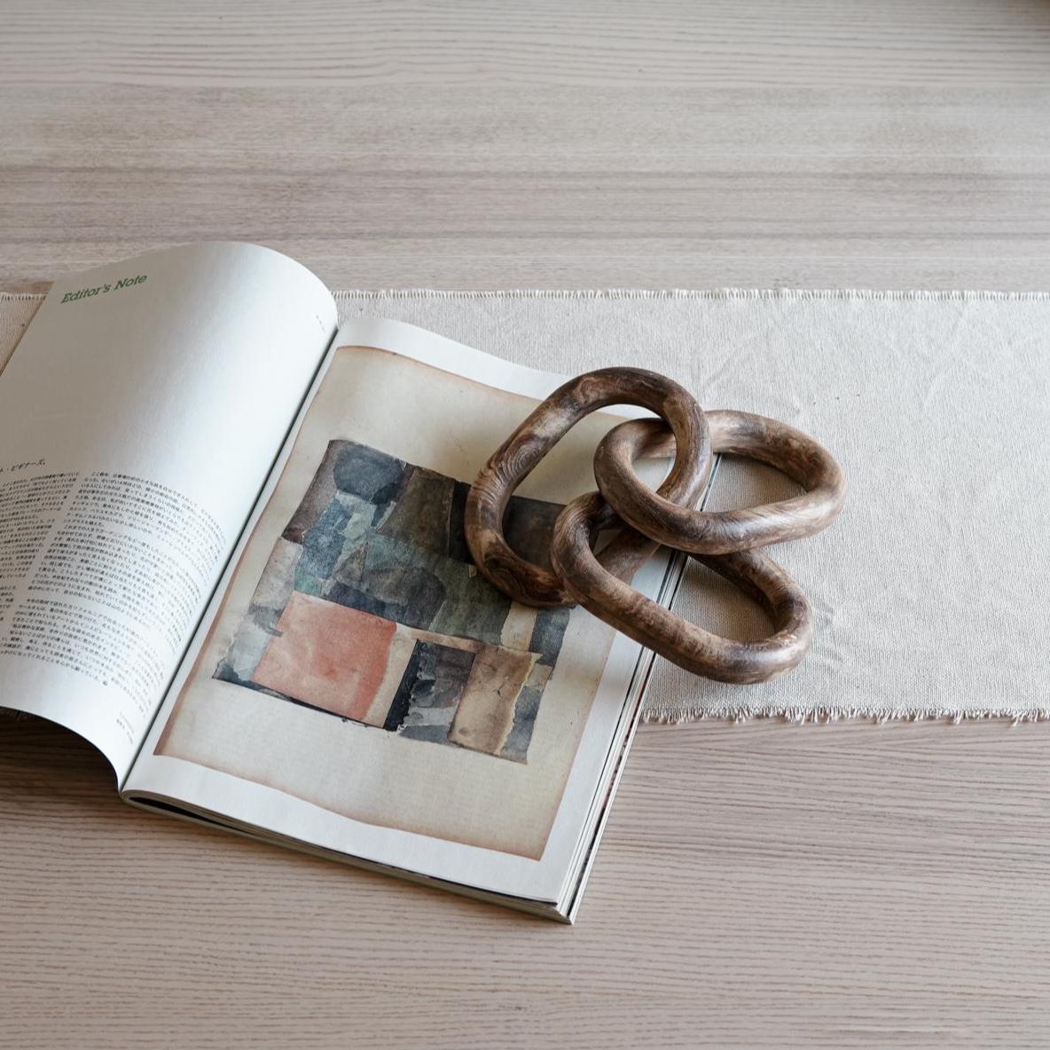 Close-up of handcrafted ceramic links with marble pattern