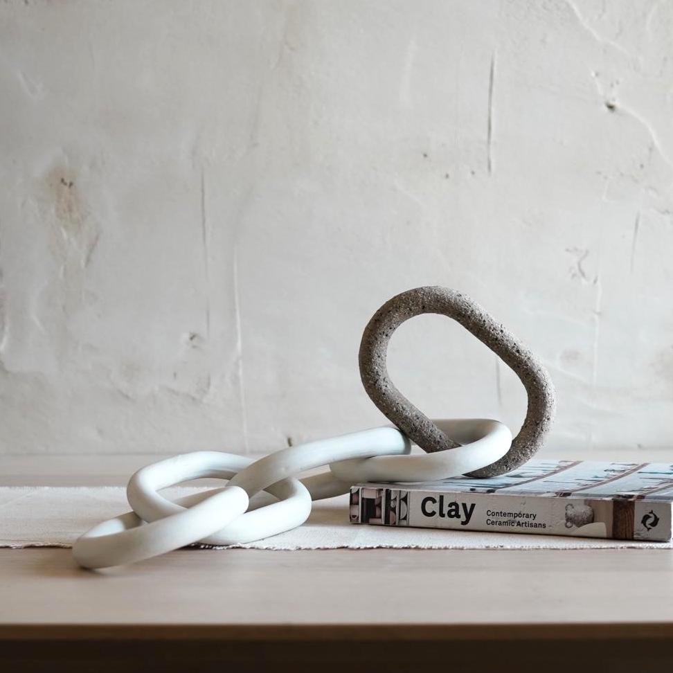 Close-up of handmade porcelain and ceramic chain links texture