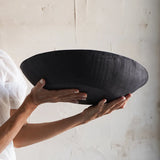 textured exterior of large black bowl