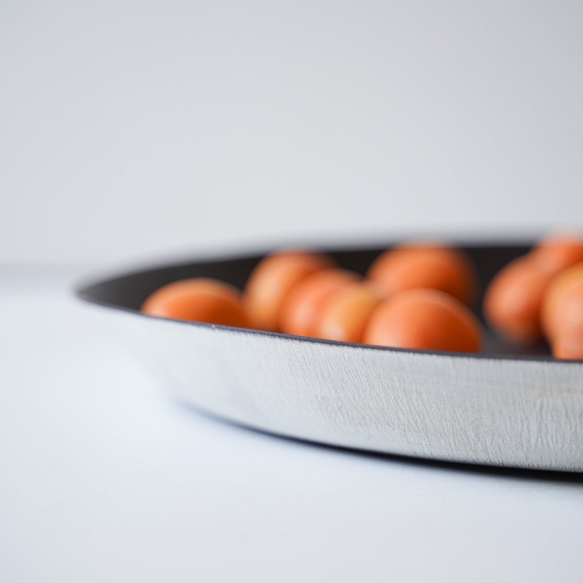 Detail of textured outer rim of decorative shallow platter