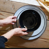 a plates setting of one black bowl, one salad plate and one dinner plate