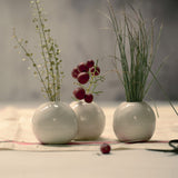 set of three miniature white ceramic vases
