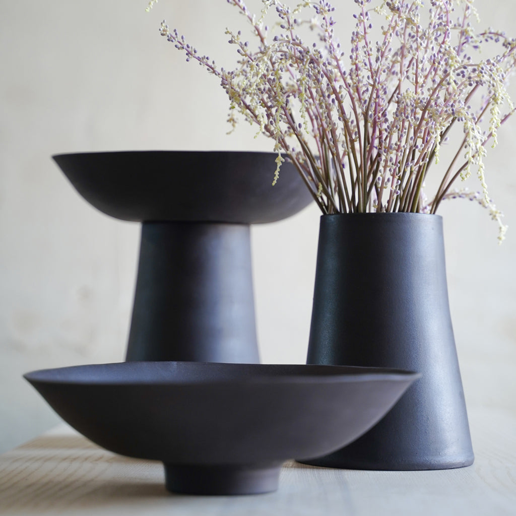Tall black ceramic pedestal bowl composed of a bowl and vase, modern minimalist decor