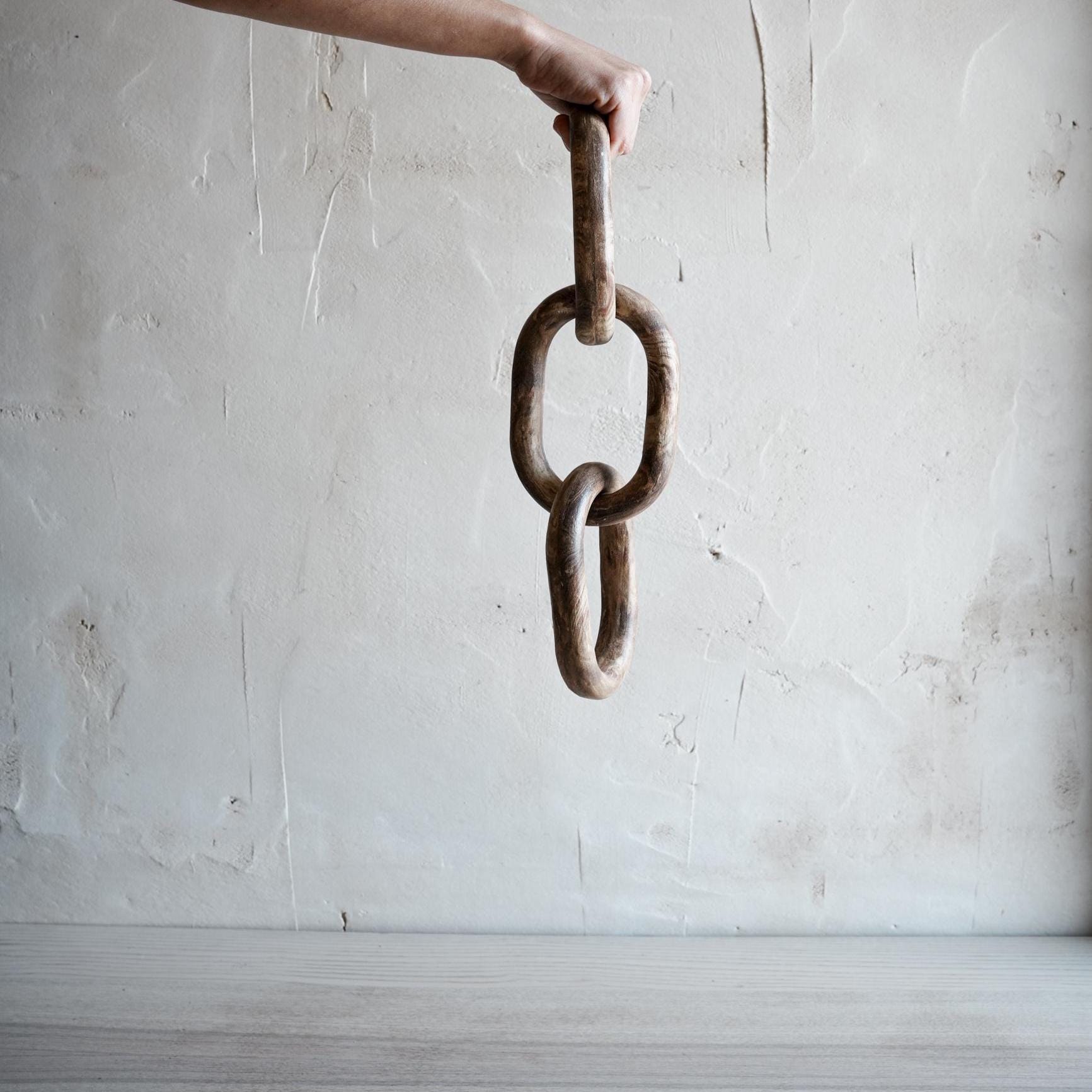 3-link ceramic chain displayed on contemporary sideboard