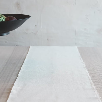 Video showing a handmade black stoneware pedestal bowl from multiple angles, minimalist ceramic centerpiece