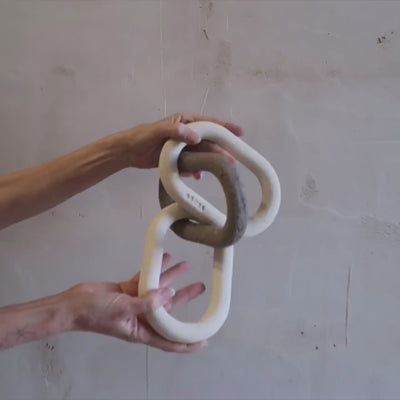 Handmade ceramic link chain sculpture in matte neutral finish