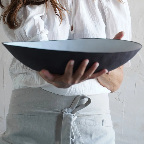 Large black bowl with white interior