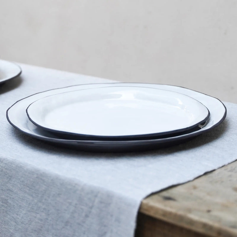a table setting with a salad plate on a dinner plate
