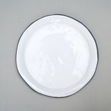 white farmhouse plate with a slight black rim