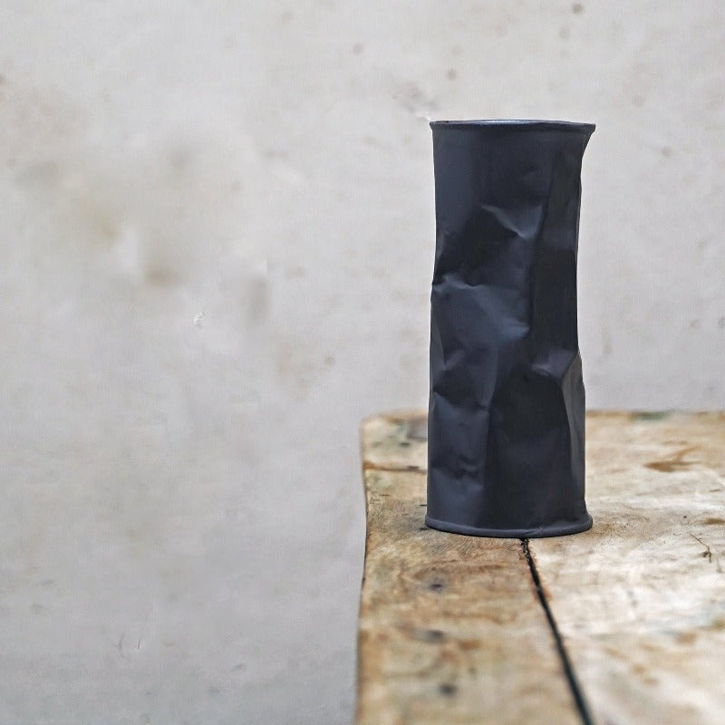 black crumpled vase