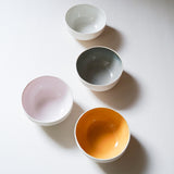 four porcelain pastel bowls