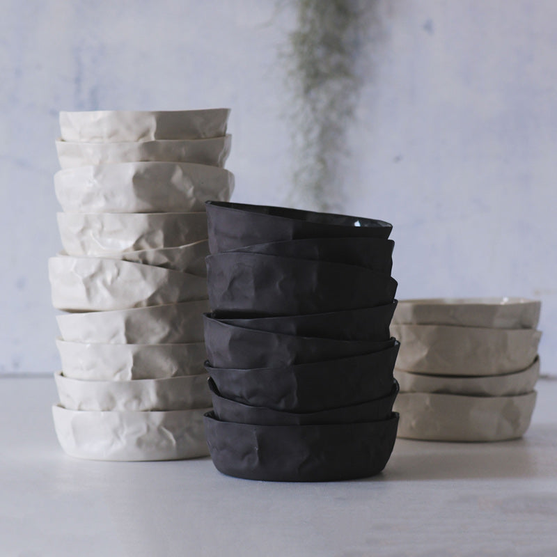 black and white rumpled bowls stacked
