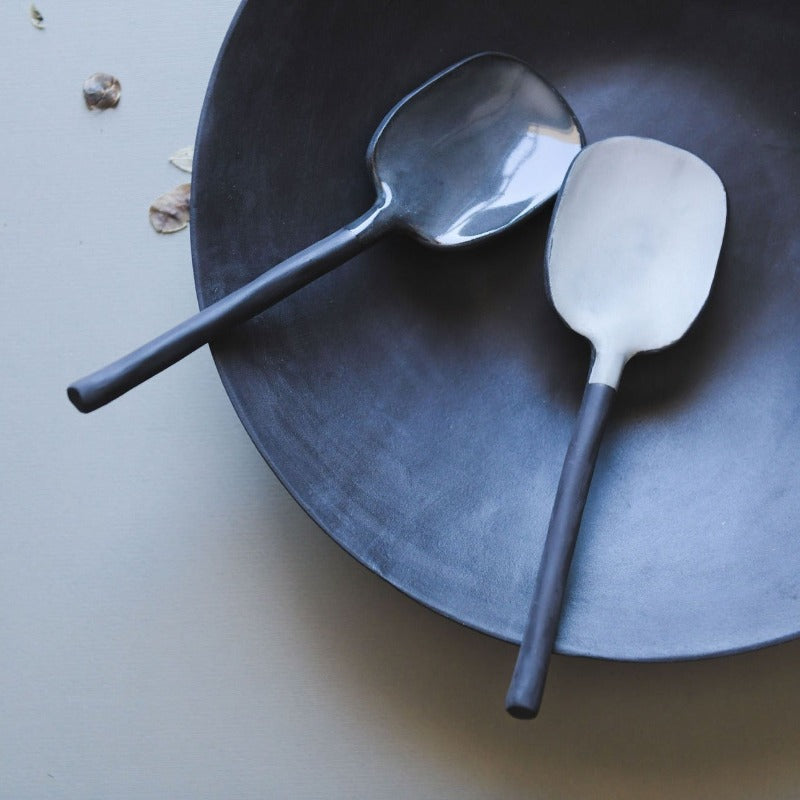 black and white spoons in a bowl