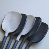 black and white ceramic spoons
