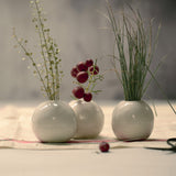 set of three miniature white ceramic vases 