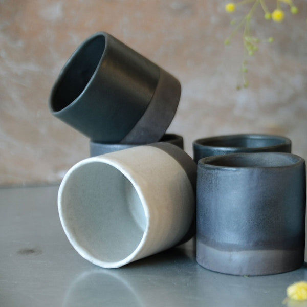 5 black & white espresso cups artistically placed