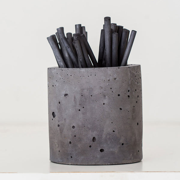 concrete cylinder with charcoal